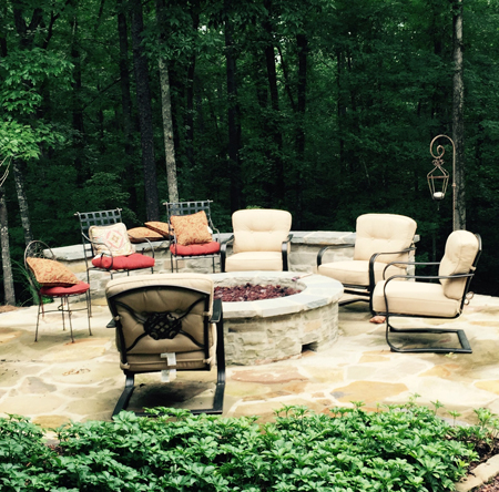 fire pit with wall and chairs